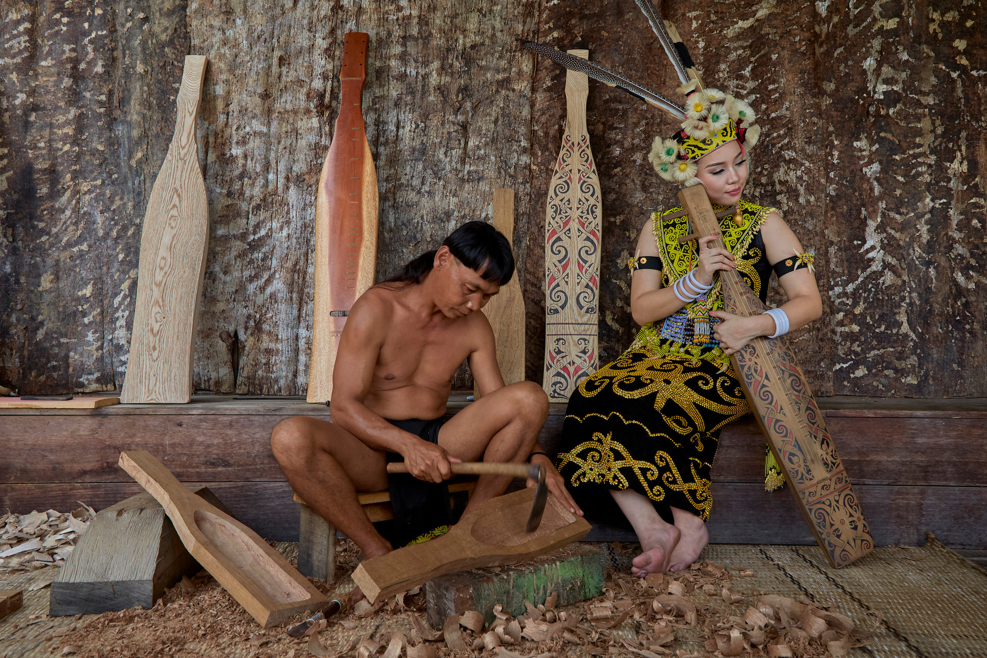 Woodcarvers at work in a Sarawak longhouse