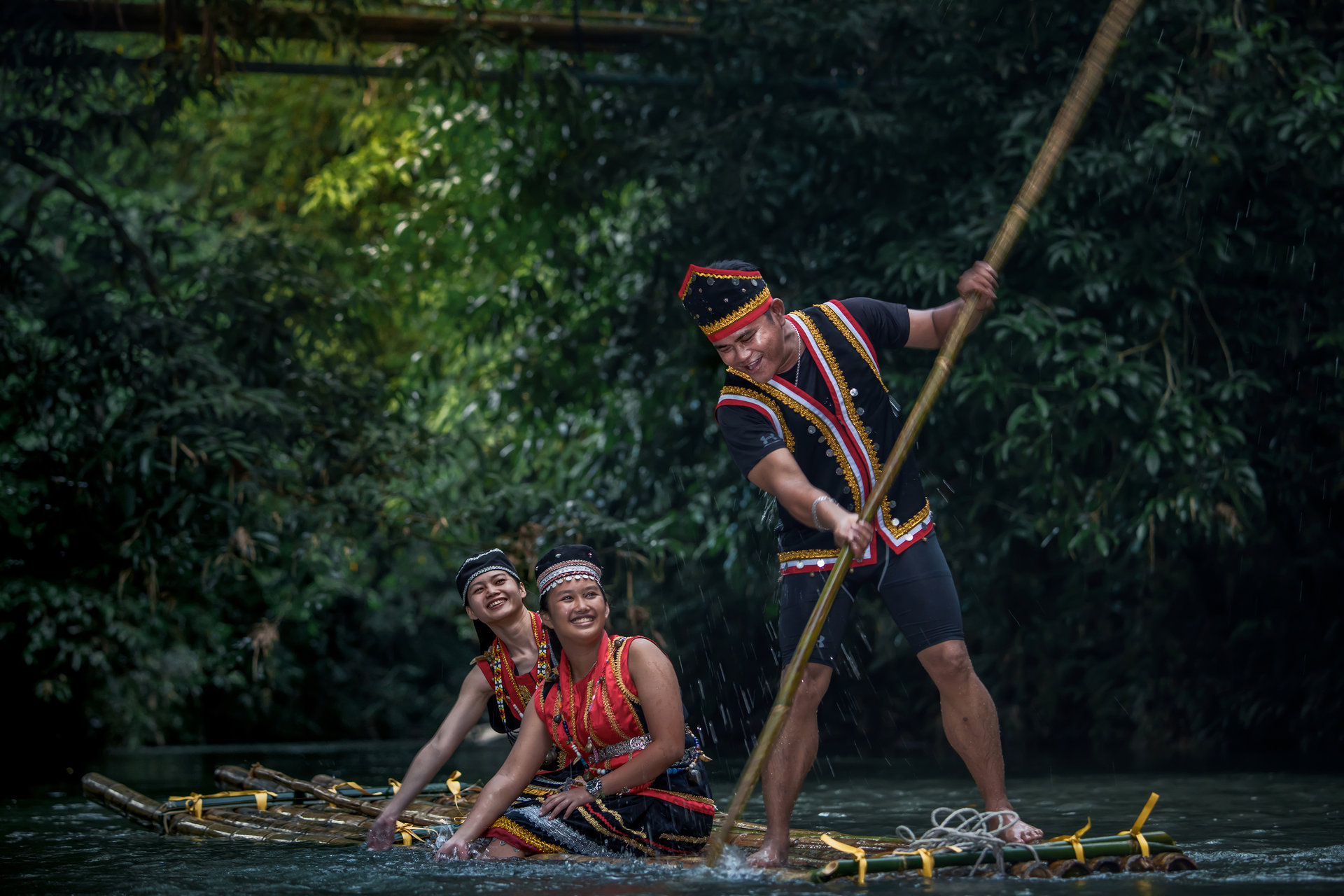 Bamboo rafting in traditional dress