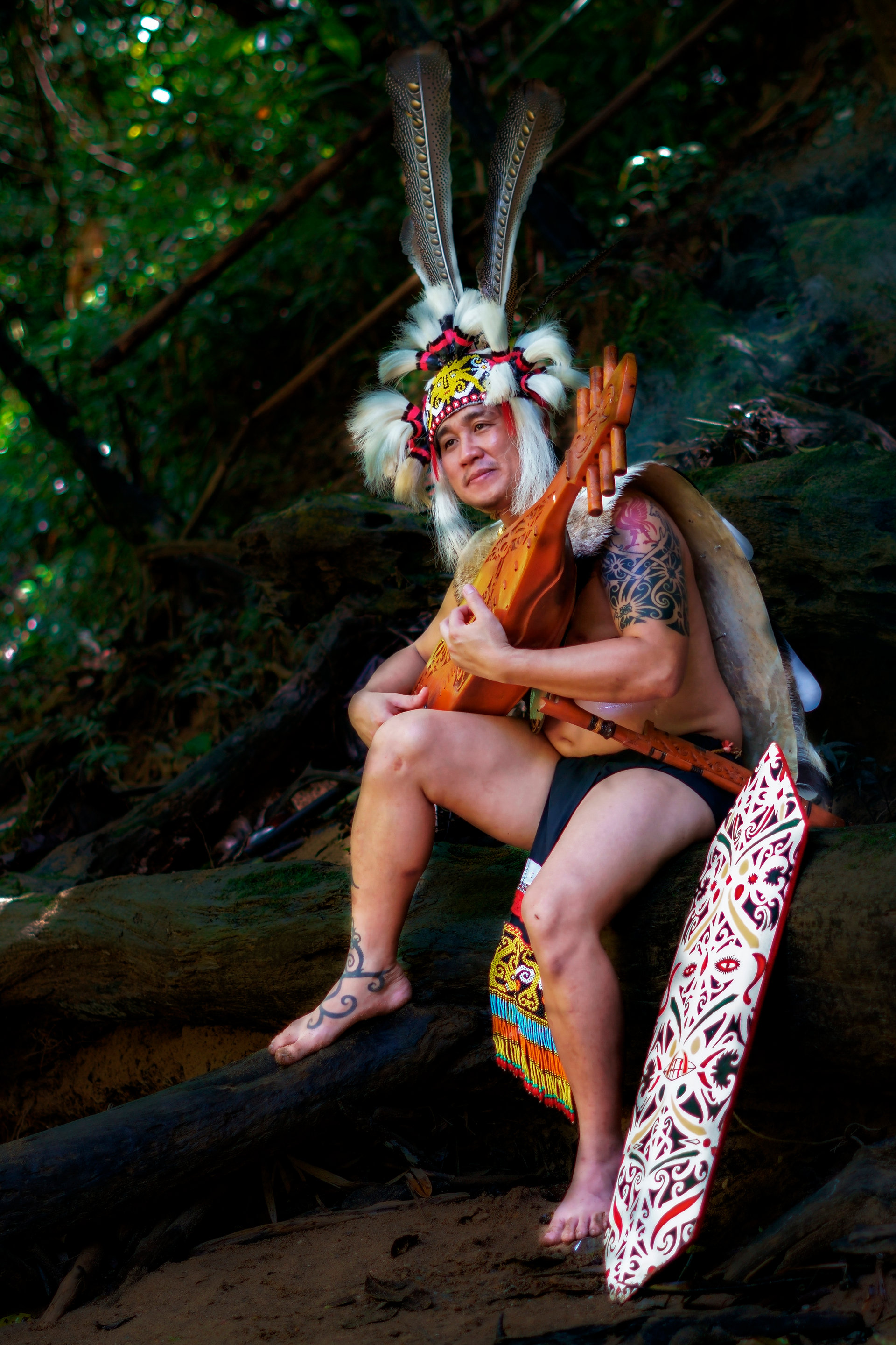 Iban longhouse host in traditional attire