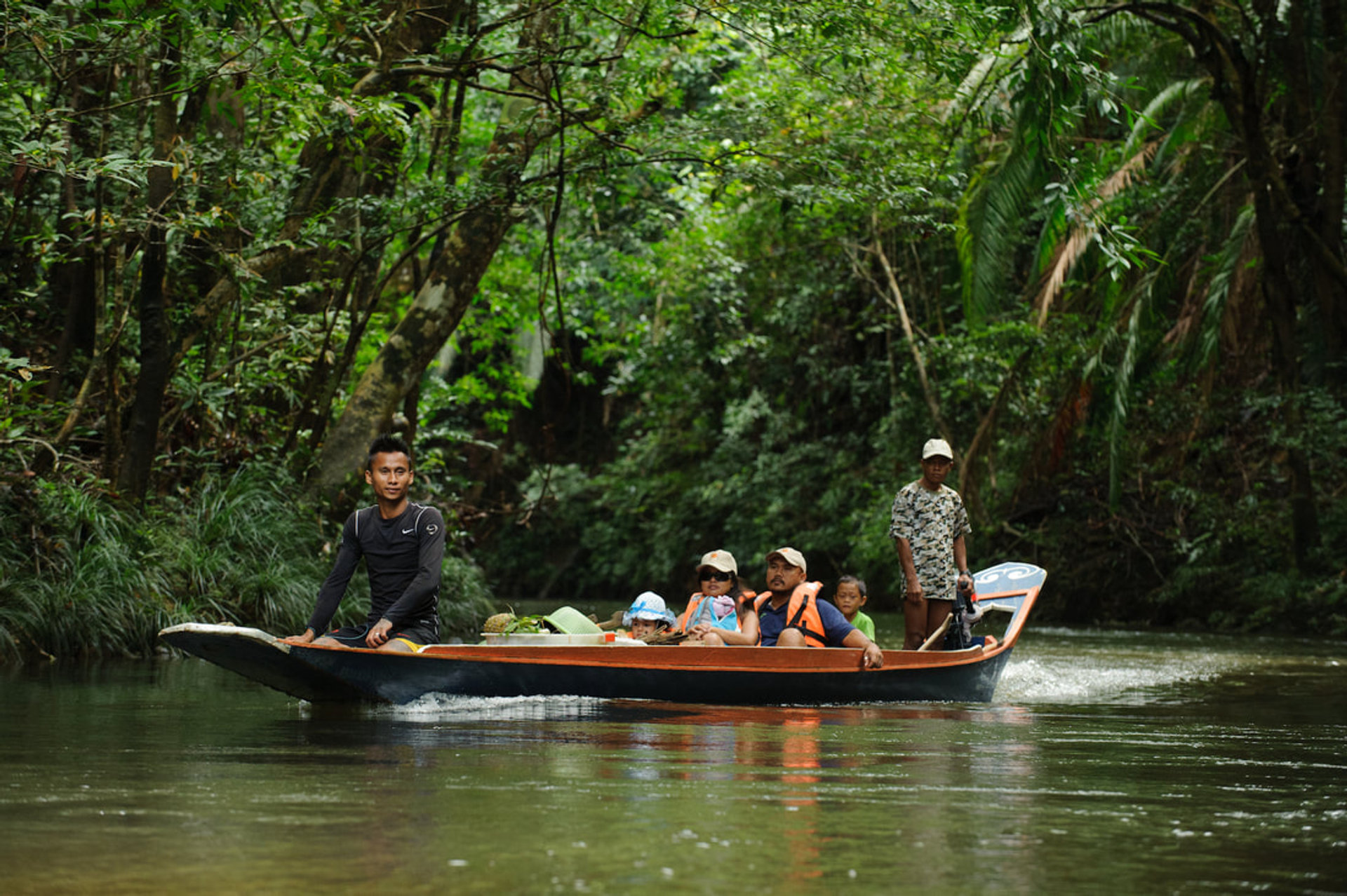 Longboat on a river at Batang Ai