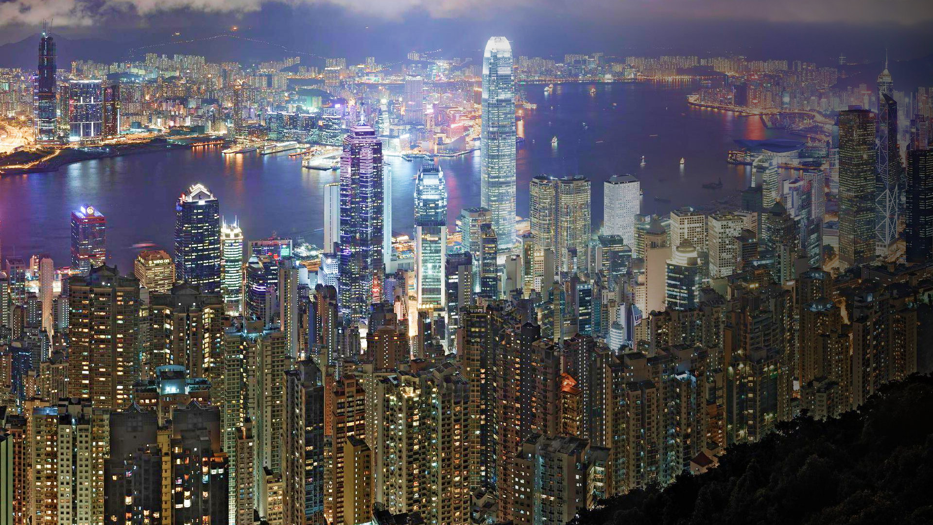 Hong Kong’s lit towers and harbour from the Peak at night